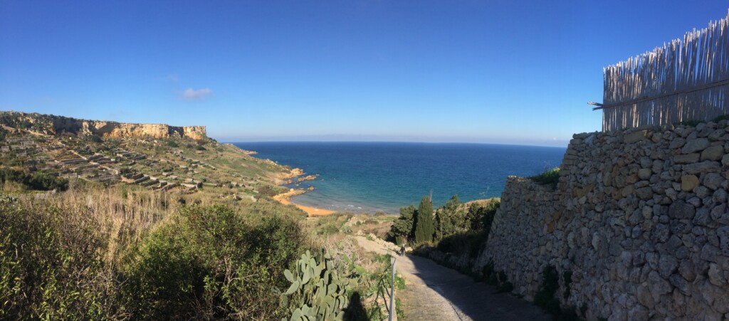 San Blas Bay with reddish sand and clear water in Gozo